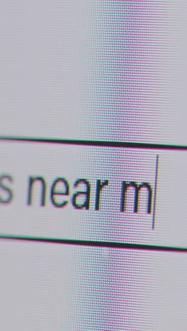 Vertical-Video-Close-Up-Of-Screen-With-Person-Typing-Vacancies-Near-Me-Into-Computer-Search-Engine